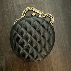 Faux leather quilted circle black purse